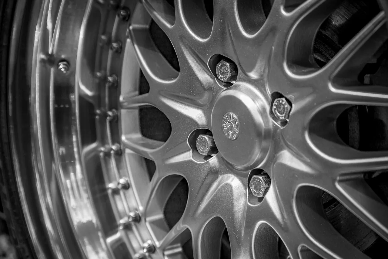 How do you clean polished aluminum wheels safely?